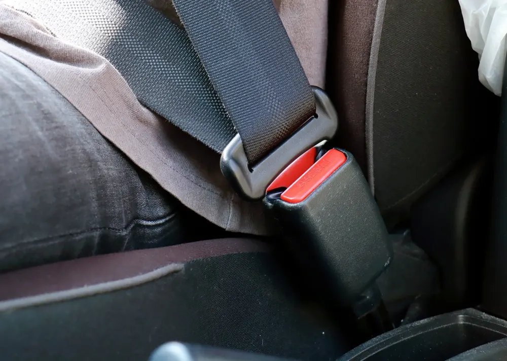 Seat belt fastened at a seating position with the buckle engaged